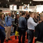 A crowd of customers checking out a live demonstration on the Anyjet Graphics Canada Booth Showcasing Digital Printing and Cutting Solutions