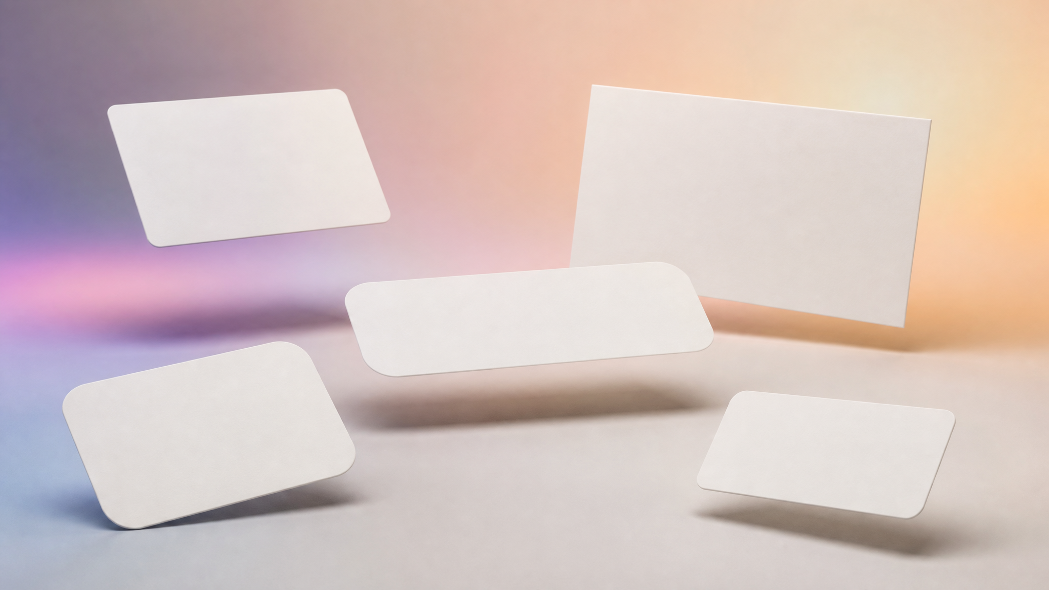 Five blank product label shapes arranged against a softly colored studio background